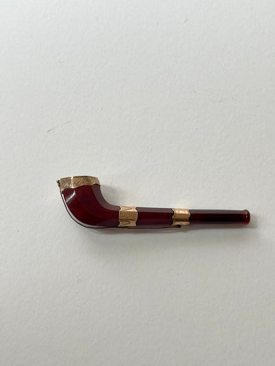 Gold mounted opium pipe.